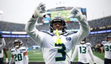 CHARLOTTE, NORTH CAROLINA - DECEMBER 28: Nick Emmanwori #3 reacts after Julian Love #20 of the Seattle Seahawks intercepted a pass during the third quarter against the Carolina Panthers at Bank of America Stadium on December 28, 2025 in Charlotte, North Carolina.