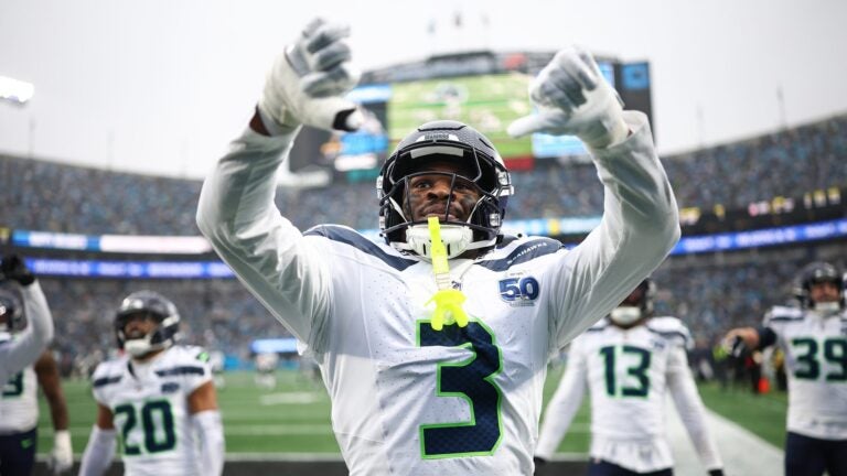CHARLOTTE, NORTH CAROLINA - DECEMBER 28: Nick Emmanwori #3 reacts after Julian Love #20 of the Seattle Seahawks intercepted a pass during the third quarter against the Carolina Panthers at Bank of America Stadium on December 28, 2025 in Charlotte, North Carolina.