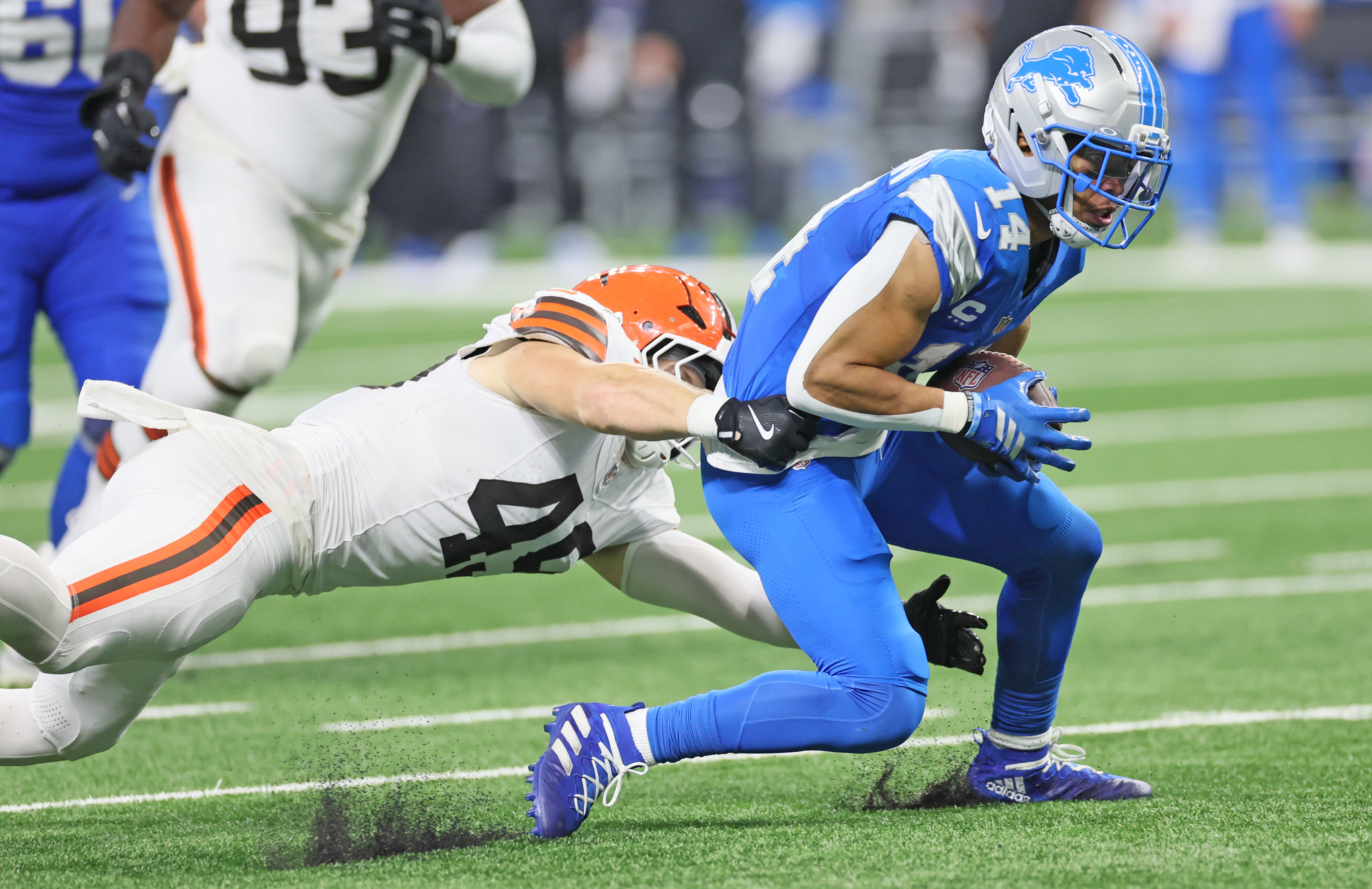 Cleveland Browns linebacker Carson Schwesinger dives for a tackle attempt on Detroit Lions wide receiver Amon-Ra St. Brown after a reception in the second half.  