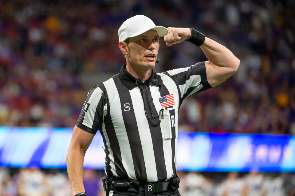ACC referee, Stuart Mullins, calls a targeting call on Oklahoma Sooners defensive back Brendan Radley-Hiles (44) during the College Football Playoffs Semifinal Chick-fil-A Peach Bowl between the LSU Tigers and the Oklahoma Sooners on December 28, 2019