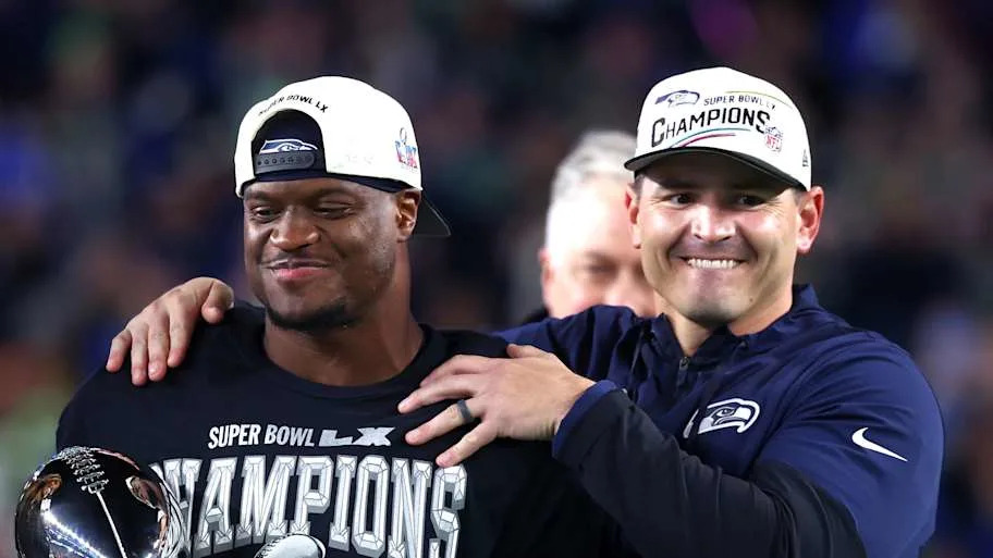 Seattle Seahawks head coach Mike MacDonald and running back Kenneth Walker III celebrate with the Vince Lombardi trophy.