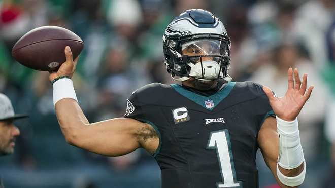 Philadelphia Eagles quarterback Jalen Hurts. Philadelphia Eagles quarterback Jalen Hurts warms up before an NFL football game between the Philadelphia Eagles and the New York Giants Monday, Dec. 25, 2023, in Philadelphia. (AP Photo/Matt Slocum)