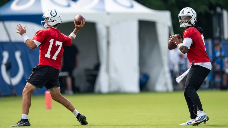 Daniel Jones and Anthony Richardson throw passes during Colts training camp practice.