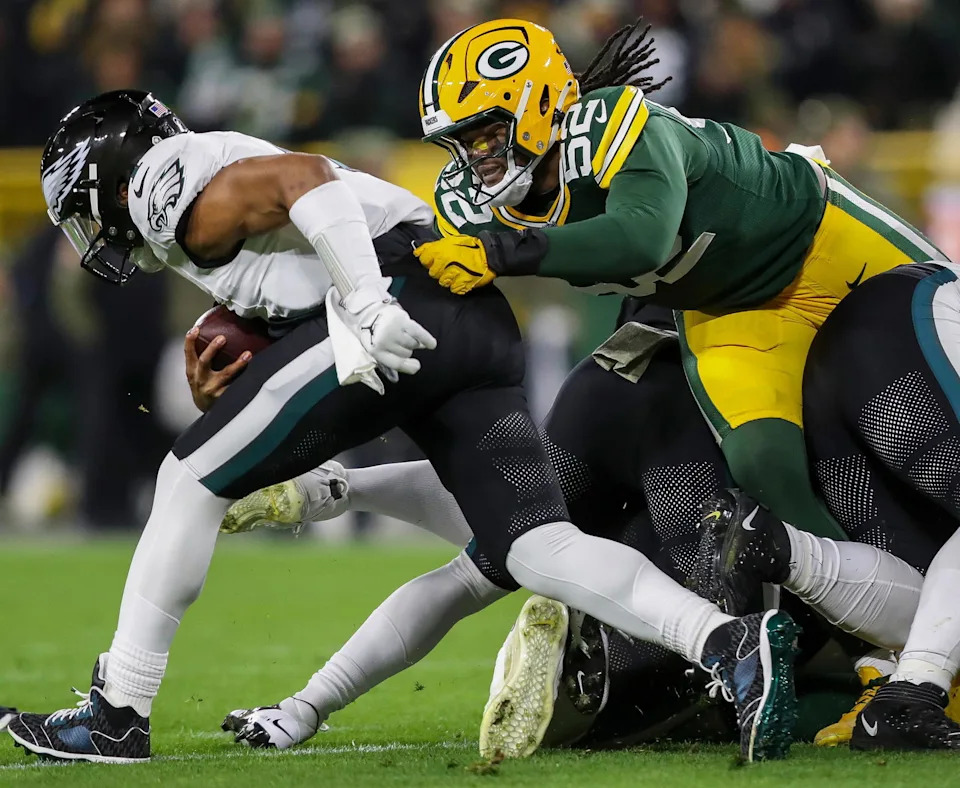 Green Bay Packers defensive end Rashan Gary (52) tackles Philadelphia Eagles quarterback Jalen Hurts on Monday, November 10, 2025, at Lambeau Field in Green Bay, Wis. Tork Mason/USA TODAY NETWORK-Wisconsin. 