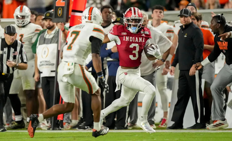 Indiana Hoosiers wide receiver Omar Cooper Jr. (3) runs down the sideline past Miami (FL) Hurricanes defenders Monday, Jan. 19, 2026, during the College Football Playoff National Championship game. Grace Hollars/IndyStar-USA TODAY NETWORK via Imagn Images