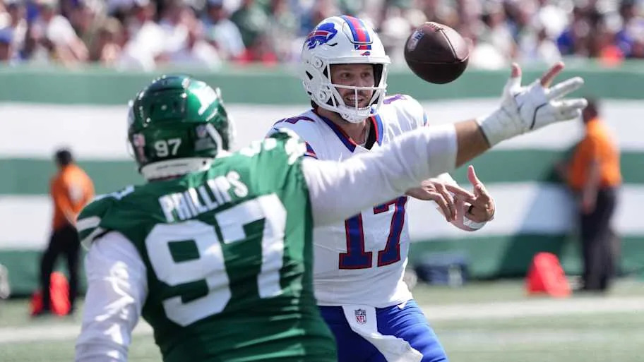 Buffalo Bills quarterback Josh Allen (17) makes a throw against New York Jets defensive tackle Harrison Phillips