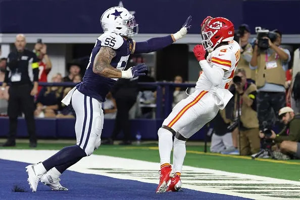 Hollywood Brown of the Kansas City Chiefs catches a touchdown while defended by Logan Wilson of the Dallas Cowboys.