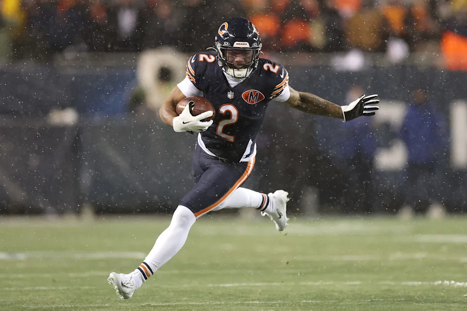 CHICAGO, ILLINOIS - JANUARY 18: DJ Moore #2 of the Chicago Bears carries the ball Los Angeles Rams during the first quarter in the NFC Divisional Playoffs at Soldier Field on January 18, 2026 in Chicago, Illinois. (Photo by Michael Reaves/Getty Images)