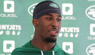 Breece Hall talks with the media