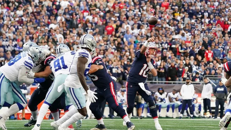 Patriots quarterback Mac Jones throws a pass against the Cowboys at Gillette Stadium.