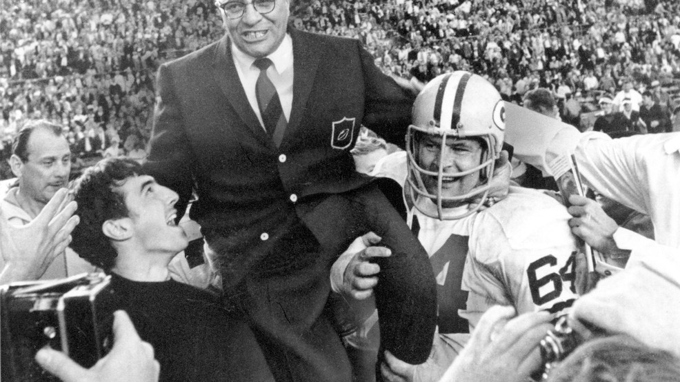 In this Jan. 14, 1968, file photo, Green Bay Packers coach Vince Lombardi is carried off the field after his team defeated the Oakland Raiders 33-14 in Super Bowl II in Miami, Fla. Packers guard Jerry Kramer (64) is at right. (AP Photo/File)