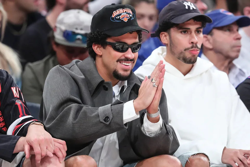 Global recording artist Bad Bunny sits courtside at an NBA game.Wendell Cruz-Imagn Images