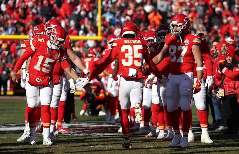 Jaylen Watson of the Kansas City Chiefs is greeted by Patrick Mahomes and Travis Kelce during player introductions prior to the game against the Los Angeles Chargers at Arrowhead Stadium on December 14, 2025 in Kansas City, Missouri. Getty Images
