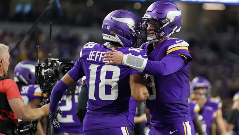 Justin Jefferson celebrating with J.J. McCarthy after a touchdown. Justin Jefferson Vikings QB verdict.