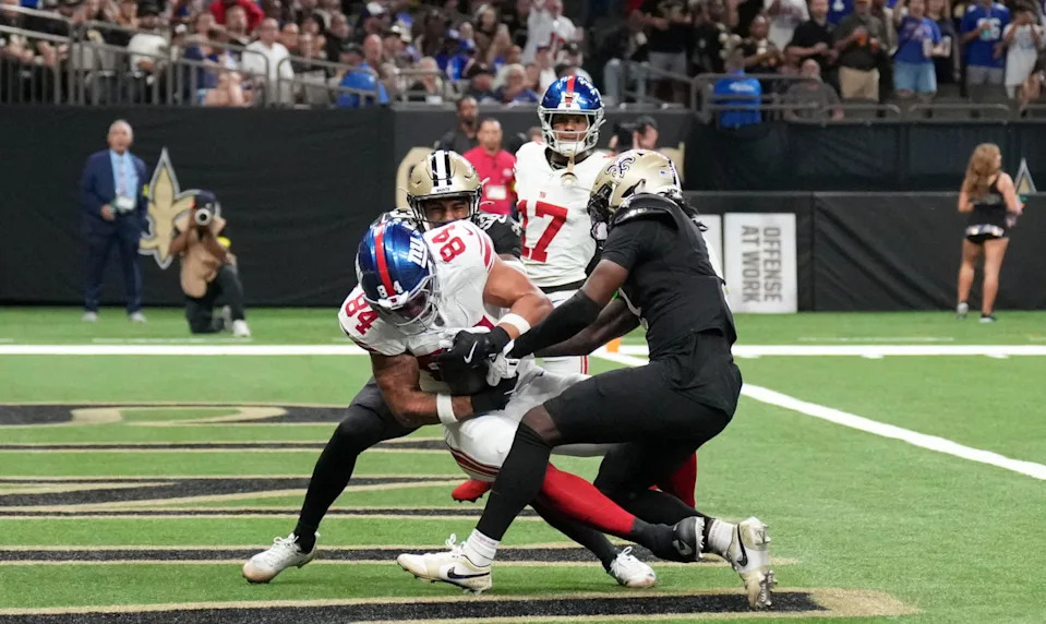 New York Giants tight end Theo Johnson (84) scores a touchdown against the New Orleans Saints during the second quarter at Caesars Superdome. Matthew Hinton-Imagn Images