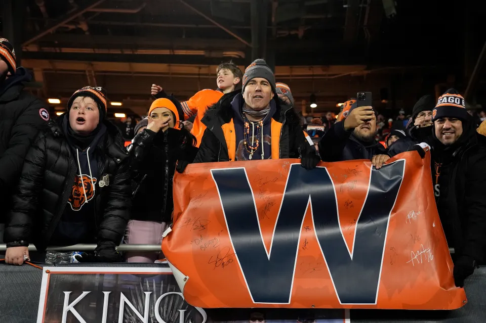Chicago Bears fans celebrate against the Green Bay Packers after the NFC Wild Card Playoff game at Soldier Field on January 10, 2026