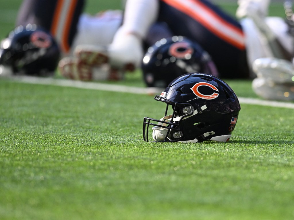 Chicago Bears helmet on a green field.