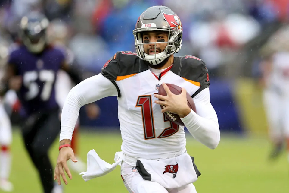 BALTIMORE, MARYLAND - DECEMBER 16: Mike Evans #13 of the Tampa Bay Buccaneers runs with the ball after catching a first half pass against the Baltimore Ravens at M&T Bank Stadium on December 16, 2018 in Baltimore, Maryland. (Photo by Rob Carr/Getty Images)
