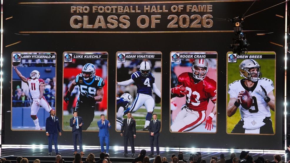 Pro Football Hall of Fame Class of 2026 Larry Fitzgerald, Luke Kuechly, kicker Adam Vinatieri, Roger Craig and Drew Brees stand of stage during the NFL Honors award show, Thursday, Feb. 5, 2026, in San Francisco. (AP Photo/Charlie Riedel)