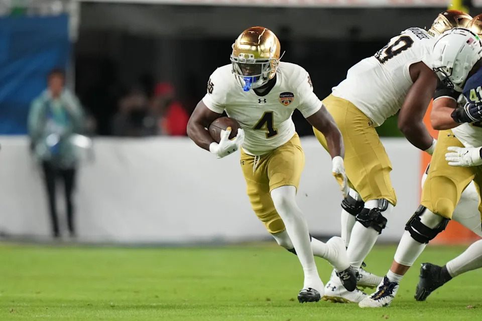 MIAMI GARDENS, FL - JANUARY 09: Notre Dame Fighting Irish running back Jeremiyah Love (4) rushes with the ball during the Penn State Nittany Lions versus Notre Dame Fighting Irish College Football Playoff Semifinal at the Capital One Orange Bowl on January 9, 2025, at Hard Rock Stadium in Miami Gardens, FL. (Photo by Peter Joneleit/Icon Sportswire via Getty Images)Icon Sportswire/Getty Images