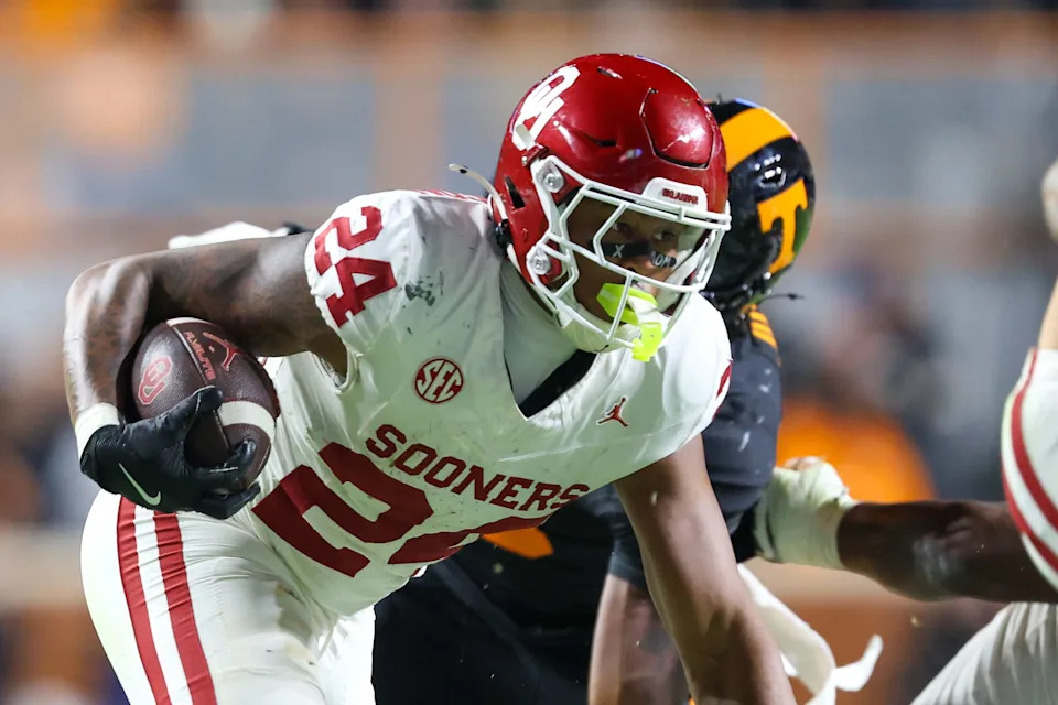 Nov 1, 2025; Knoxville, Tennessee, USA; Oklahoma Sooners running back Xavier Robinson (24) runs the ball against the Tennessee Volunteers during the second half at Neyland Stadium. Mandatory Credit: Randy Sartin-Imagn Images