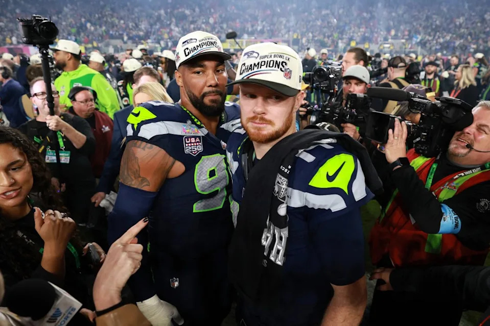 Seattle Seahawks quarterback Sam Darnold (14) and defensive end Leonard Williams (99) react after defeating the New England Patriots in Super Bowl LX at Levi’s Stadium. Mandatory Credit: Mark J. Rebilas-Imagn Images IMAGN IMAGES via Reuters Connect