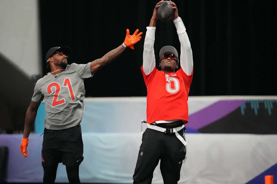 Cincinnati Bengals receiver Tee Higgins catches the ball in front of Cleveland Browns cornerback Denzel Ward