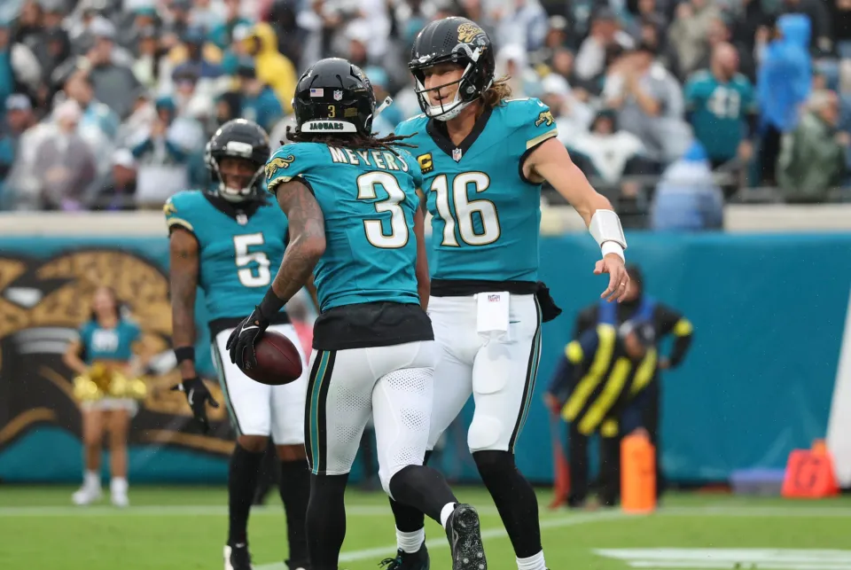 Jakobi Meyers #3 celebrates a touchdown with Trevor Lawrence #16 of the Jacksonville Jaguars during the first quarter of an NFL 2025 game against the Indianapolis Colts