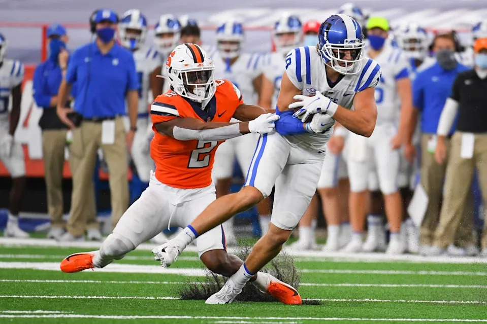Oct 10, 2020; Syracuse, New York, USA; Duke Blue Devils wide receiver Jake Bobo (19) runs with the ball after a catch as Syracuse Orange defensive back Ifeatu Melifonwu (2) defends during the first quarter at the Carrier Dome. Mandatory Credit: Rich Barnes-USA TODAY Sports