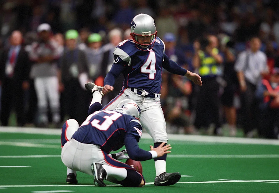 Feb 3, 2002; New Orleans, LA, USA; New England Patriots kicker Adam Vinatieri (4) kicks the ball against the St. Louis Rams during Super Bowl XXXVI at the Louisiana Superdome. The Patriots defeated the Rams 20-17. FILE PHOTO; Mandatory Credit: USA TODAY Sports