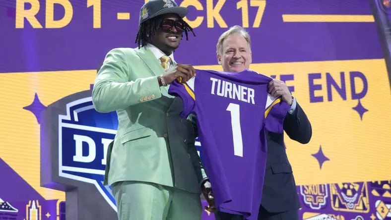 Dallas Turner poses with Roger Goodell after being drafted by the Vikings.