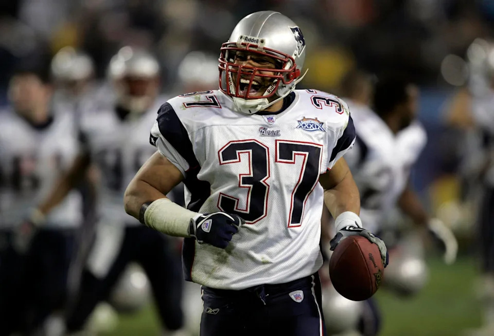 Feb 06, 2005; Jacksonville, FL, USA; New England safety Rodney Harrison (37) celebrates his late-game interception that sealed the Patriots 24-21 win over the Philadelphia Eagles in Super Bowl XXXIX at Alltel Stadium. Mandatory Credit: Photo by Dilip Vishwanat-USA TODAY Sports