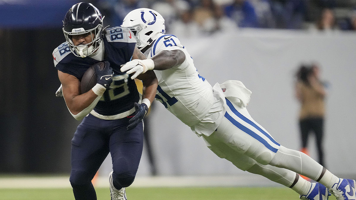 Indianapolis Colts defensive end Kwity Paye (51) dives to tackle Tennessee Titans tight end David Martin-Robinson (88) during a game against the Tennessee Titans at Lucas Oil Stadium at Lucas Oil Stadium.