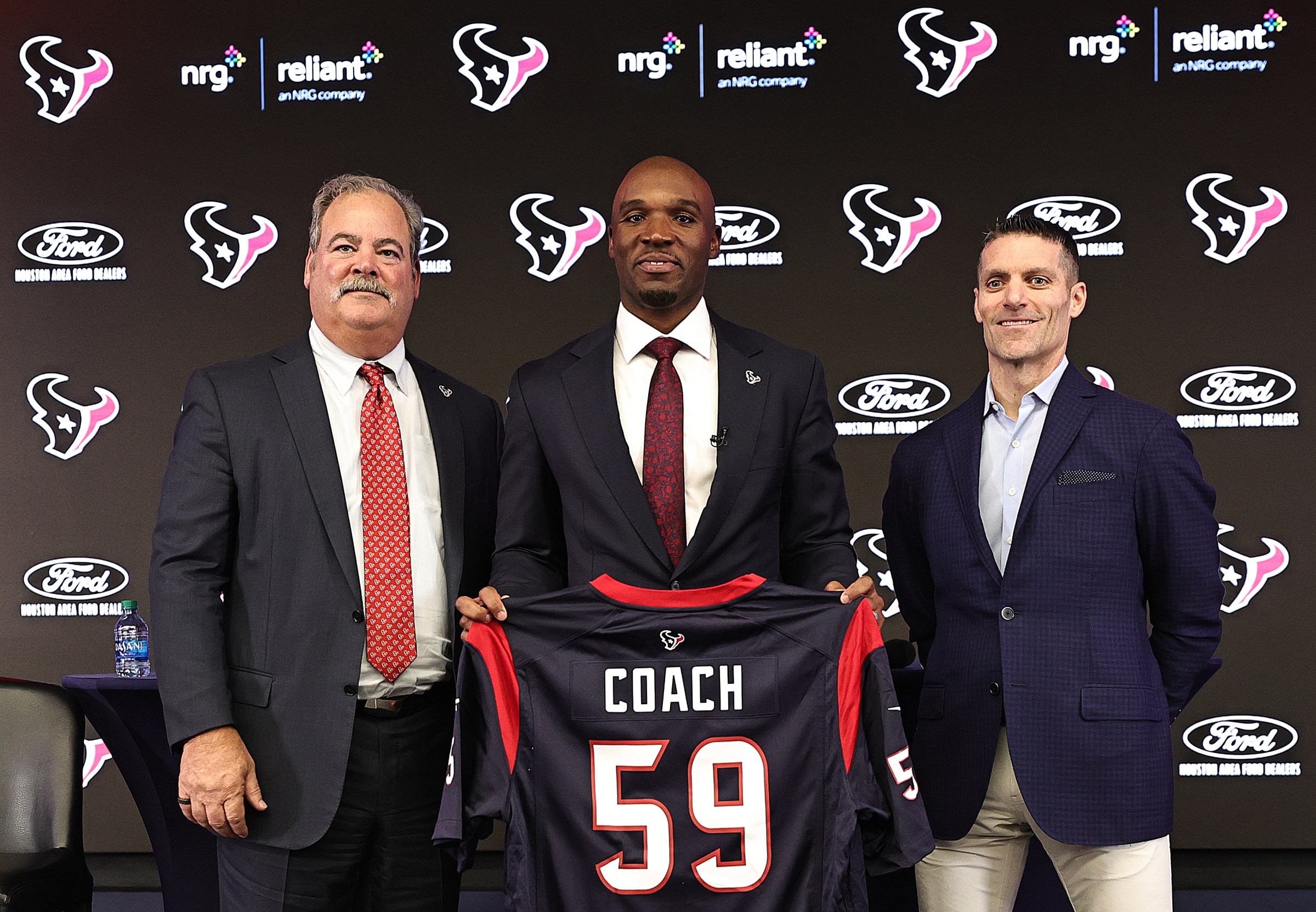 HOUSTON, TEXAS - FEBRUARY 02: DeMeco Ryans (C) is introduced as the Houston Texans head coach by Chairman and CEO Cal McNair (L) and general manager Nick Caserio at NRG Stadium on February 02, 2023 in Houston, Texas. (Photo by Bob Levey/Getty Images)
