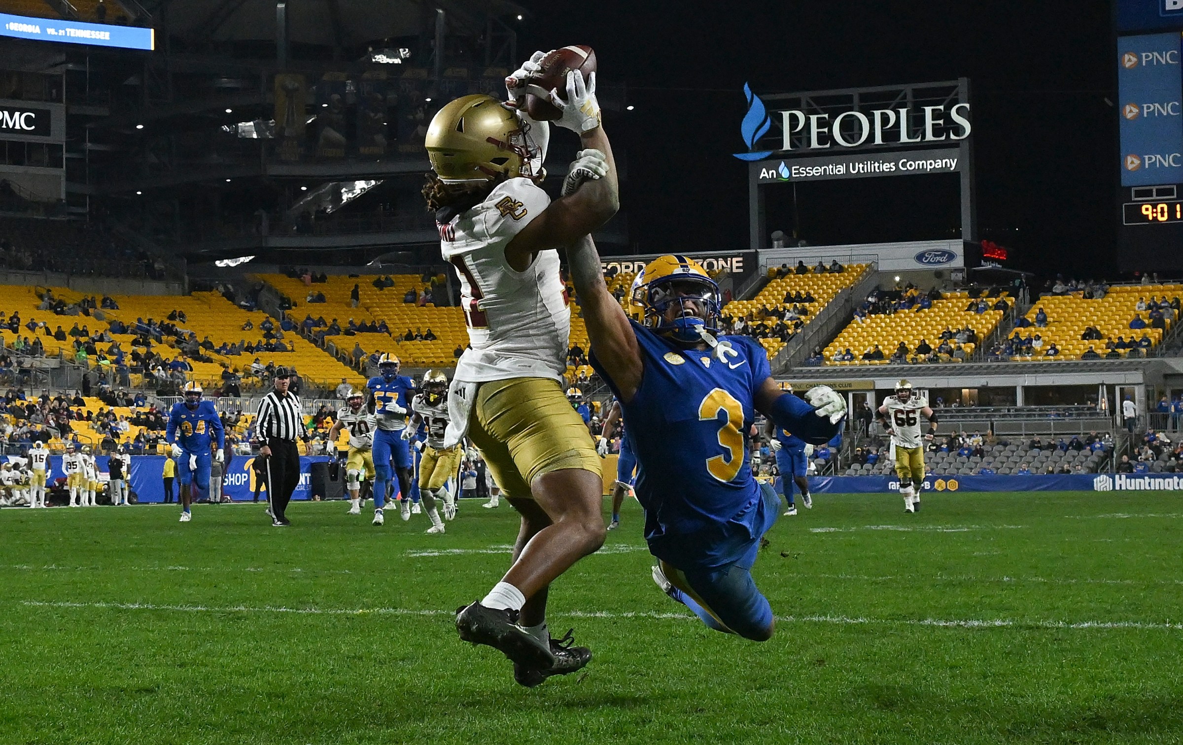 PITTSBURGH, PENNSYLVANIA - NOVEMBER 16: Lewis Bond #11 of the Boston College Eagles makes a catch for a 24-yard touchdown reception as Donovan McMillon #3 of the Pittsburgh Panthers defends in the second half during the game at Acrisure Stadium on November 16, 2023 in Pittsburgh, Pennsylvania. (Photo by Justin Berl/Getty Images)