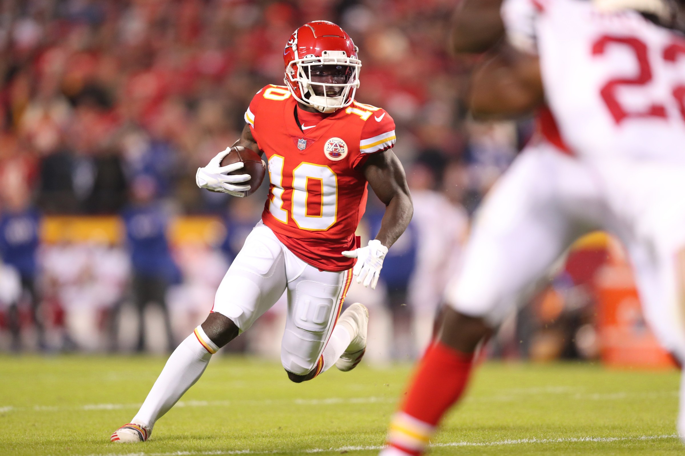 KANSAS CITY, MISSOURI - NOVEMBER 1: Tyreek Hill #10 of the Kansas City Chiefs runs upfield during an NFL football game against the New York Giants at GEHA Field at Arrowhead Stadium on November 1, 2021 in Kansas City, Missouri. (Photo by Perry Knotts/Getty Images)