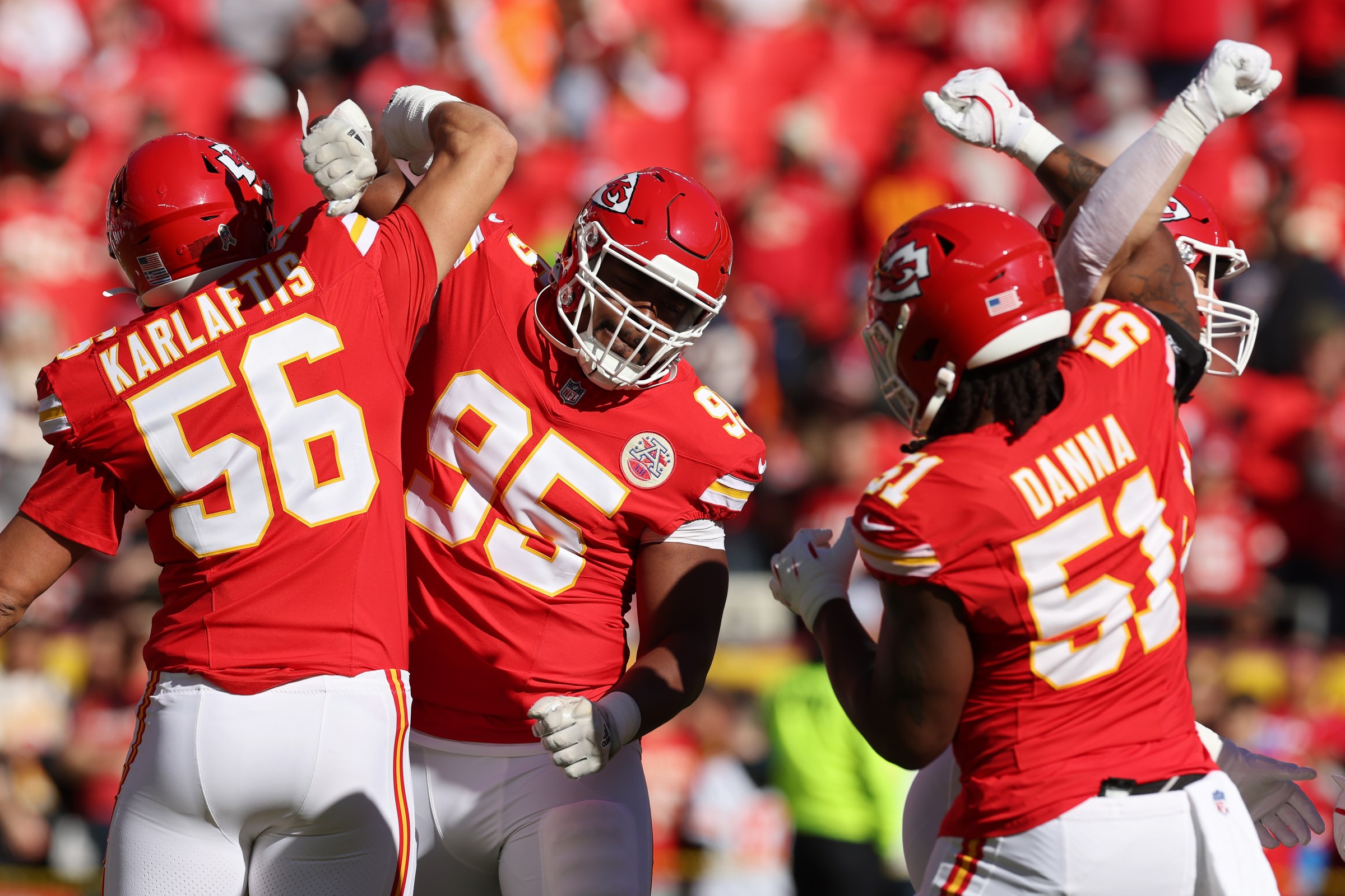 KANSAS CITY, MISSOURI - NOVEMBER 10: George Karlaftis #56, Chris Jones #95, and Mike Danna #51 of the Kansas City Chiefs celebrate prior to a game against the Denver Broncos at GEHA Field at Arrowhead Stadium on November 10, 2024 in Kansas City, Missouri. (Photo by Jamie Squire/Getty Images)