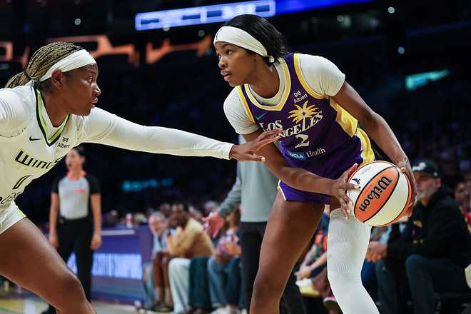LOS ANGELES, CALIFORNIA - SEPTEMBER 07: Forward Rickea Jackson #2 of the Los Angeles Sparks handles the ball defended by Amy Okonkwo #0 of the Dallas Wings in the first half at Crypto.com Arena on September 07, 2025 in Los Angeles, California. NOTE TO USER: User expressly acknowledges and agrees that, by downloading and or using this photograph, User is consenting to the terms and conditions of the Getty Images License Agreement. (Photo by Meg Oliphant/Getty Images)