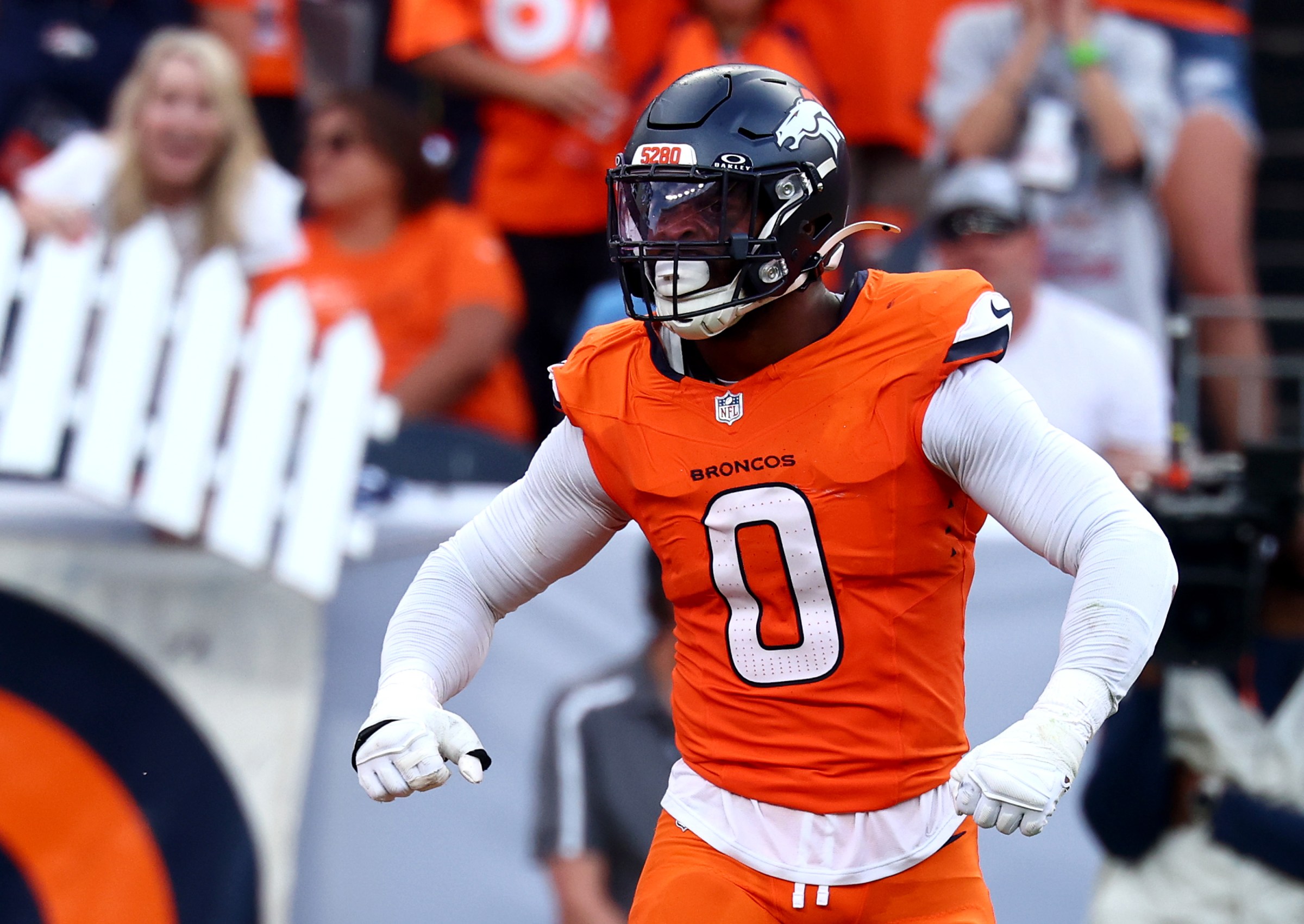 DENVER, COLORADO - SEPTEMBER 07: Jonathon Cooper #0 of the Denver Broncos celebrates a sack against Cam Ward #1 of the Tennessee Titans during the second quarter during the game at Empower Field At Mile High on September 07, 2025 in Denver, Colorado. (Photo by Tyler Schank/Getty Images)