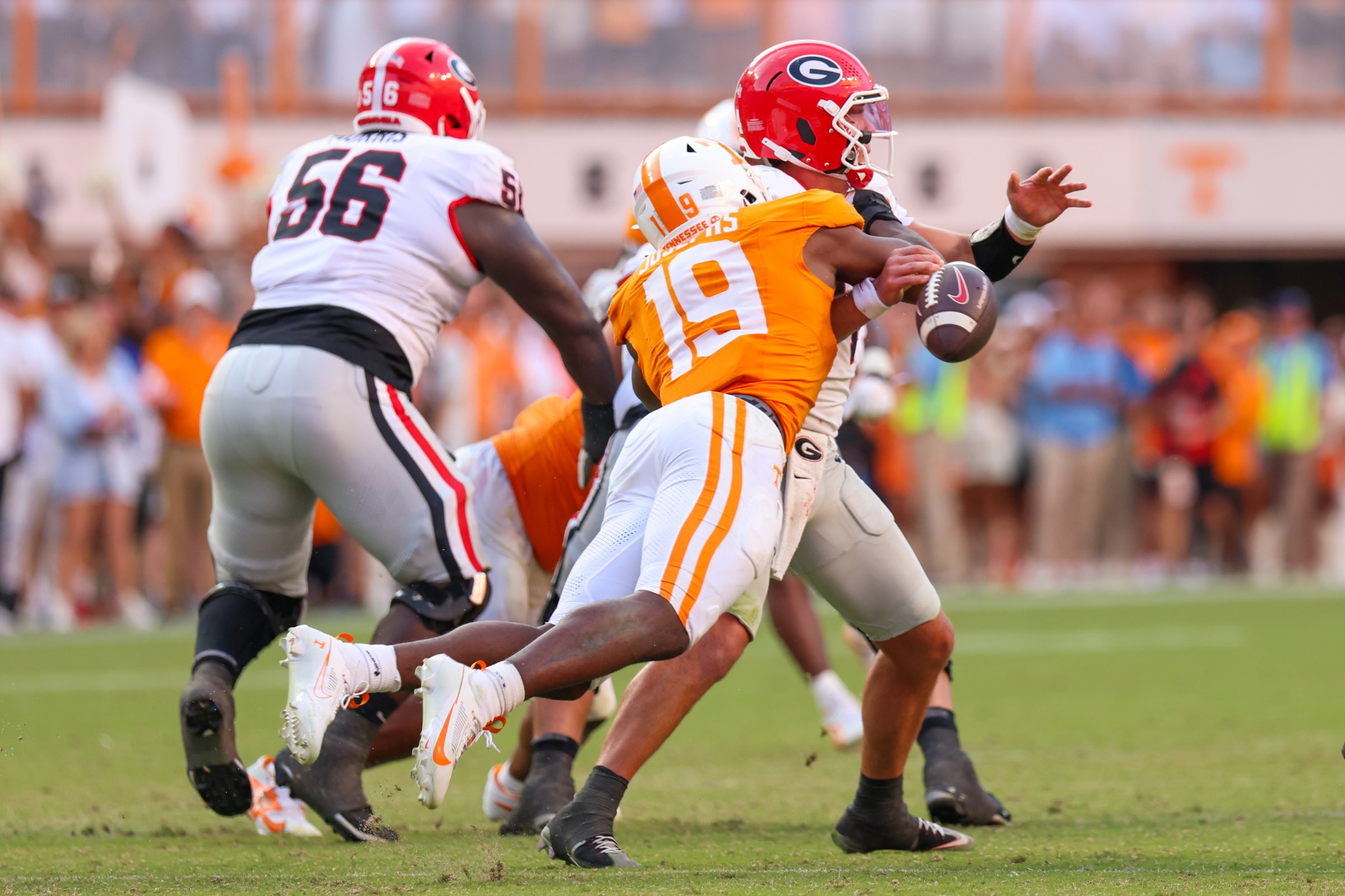 KNOXVILLE, TENNESSEE - SEPTEMBER 13: Joshua Josephs #19 of the Tennessee Volunteers forces a fumble against Gunner Stockton #14 of the Georgia Bulldogs during a game between the Tennessee Volunteers and the Georgia Bulldogs at Neyland Stadium on September 13, 2025 in Knoxville, Tennessee. (Photo by Roger Wimmer/ISI Photos/ISI Photos via Getty Images)