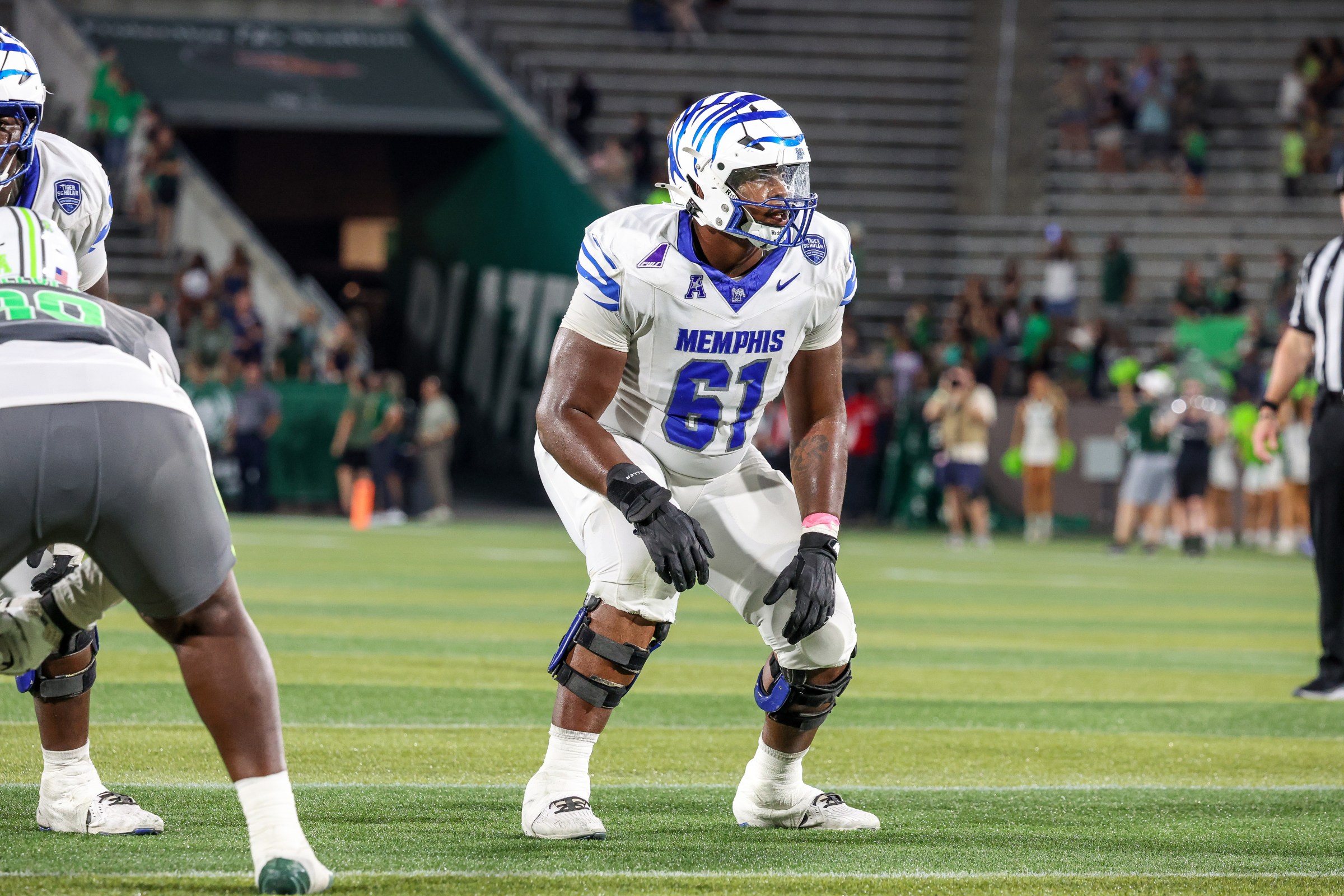BIRMINGHAM, ALABAMA - OCTOBER 18: Chris Adams #61 of the Memphis Tigers gets set for a play against the UAB Blazers during the second half at Protective Stadium on October 18, 2025 in Birmingham, Alabama. (Photo by Wes Hale/Getty Images)