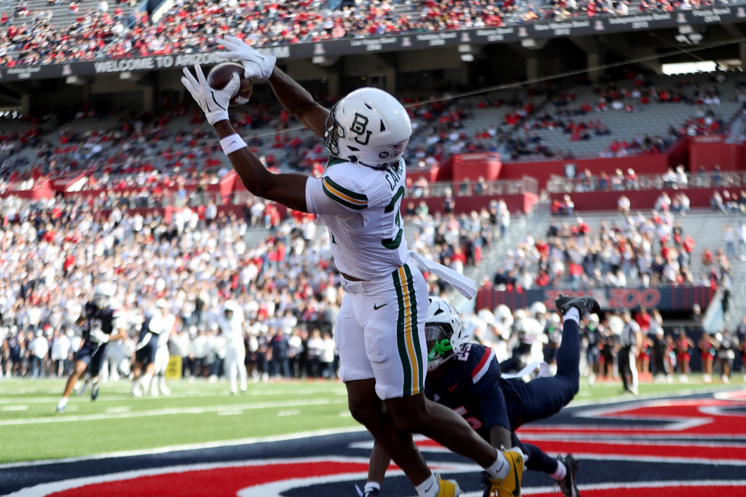 TUCSON, AZ - NOVEMBER 22: Baylor Bears wide receiver Josh Cameron (34) catches a touchdown pass during the first half of a football game between the Baylor Bears and the University of Arizona Wildcats on November 22, 2025, at Casino Del Sol Stadium in Tucson, AZ. (Photo by Christopher Hook/Icon Sportswire via Getty Images)