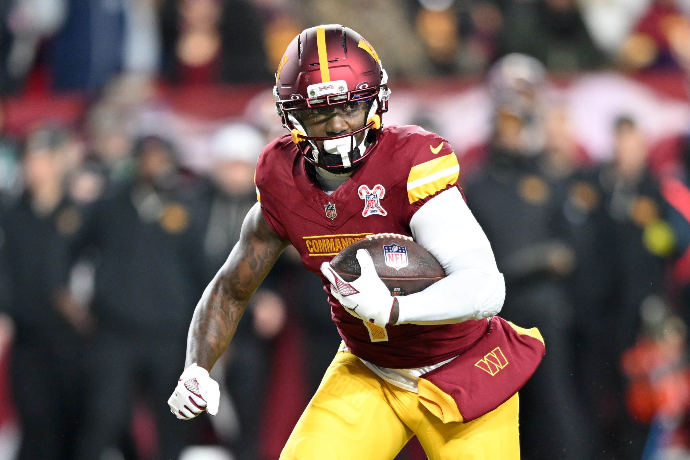 LANDOVER, MARYLAND - DECEMBER 20: Deebo Samuel #1 of the Washington Commanders runs the ball during the second quarter at Northwest Stadium on December 20, 2025 in Landover, Maryland. (Photo by Greg Fiume/Getty Images)
