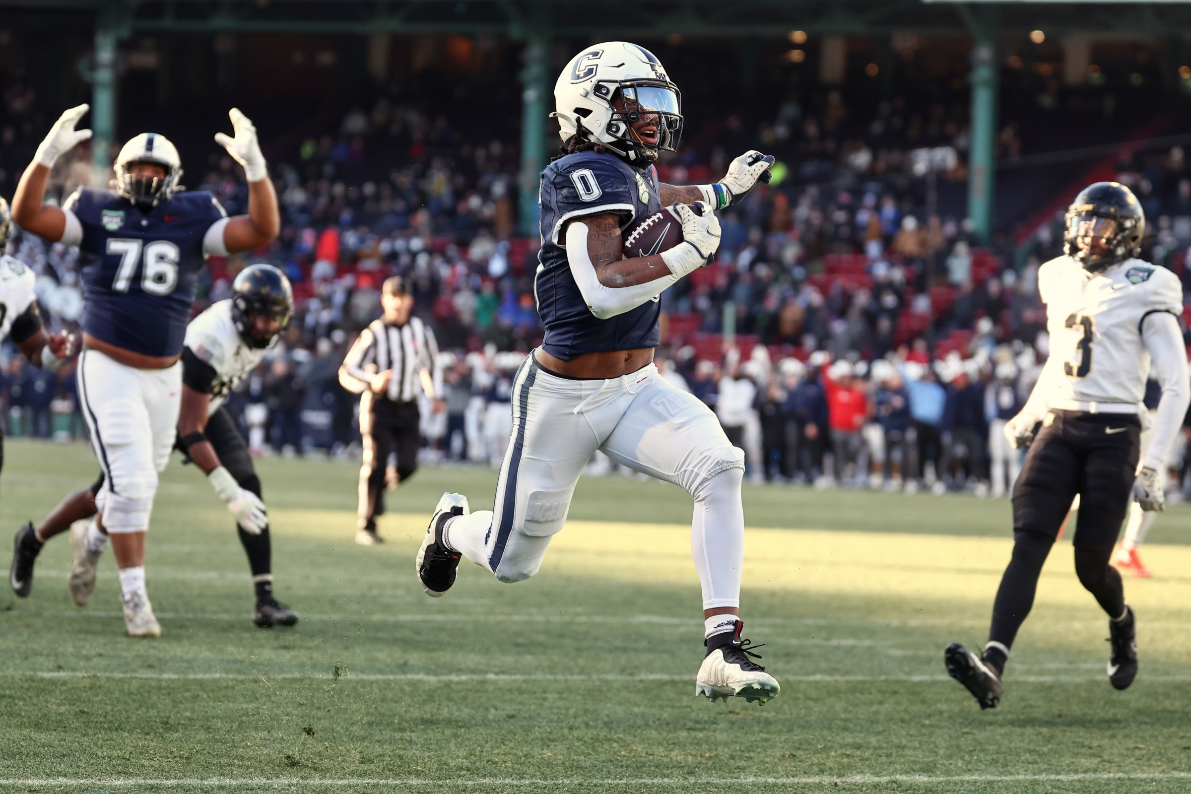 BOSTON, MA - DECEMBER 27: Skyler Bell #1 of the UConn Huskies skips into the endzone for a touchdown against the Army Black Knights during the first half of the Wasabi Fenway Bowl at Fenway Park on December 27, 2025 in Boston, Massachusetts. (Photo By Winslow Townson/Getty Images)