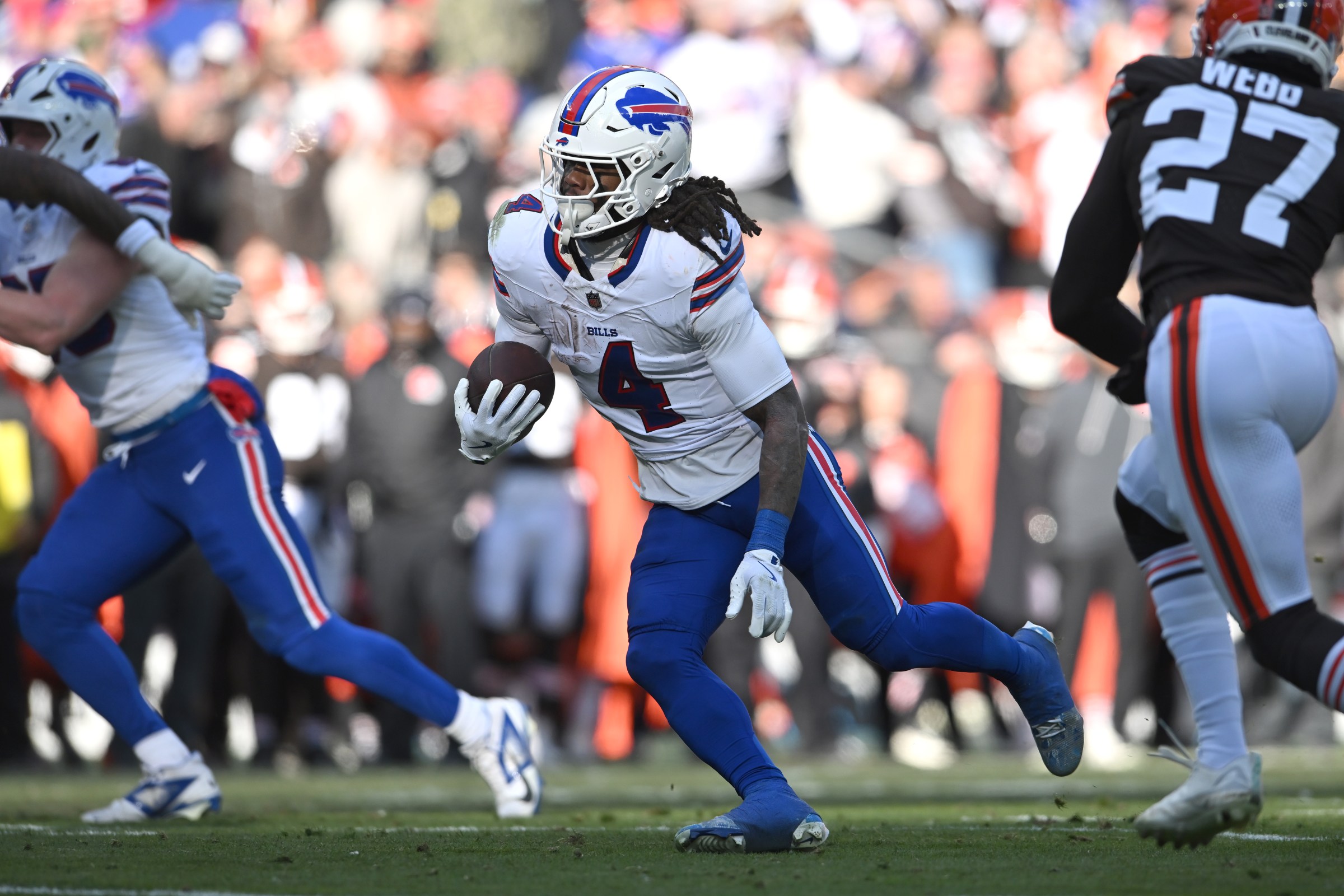 CLEVELAND, OHIO - DECEMBER 21: James Cook #4 of the Buffalo Bills carries the ball against the defense of the Cleveland Browns in the second quarter of the game at Huntington Bank Field on December 21, 2025 in Cleveland, Ohio. (Photo by Nick Cammett/Getty Images)