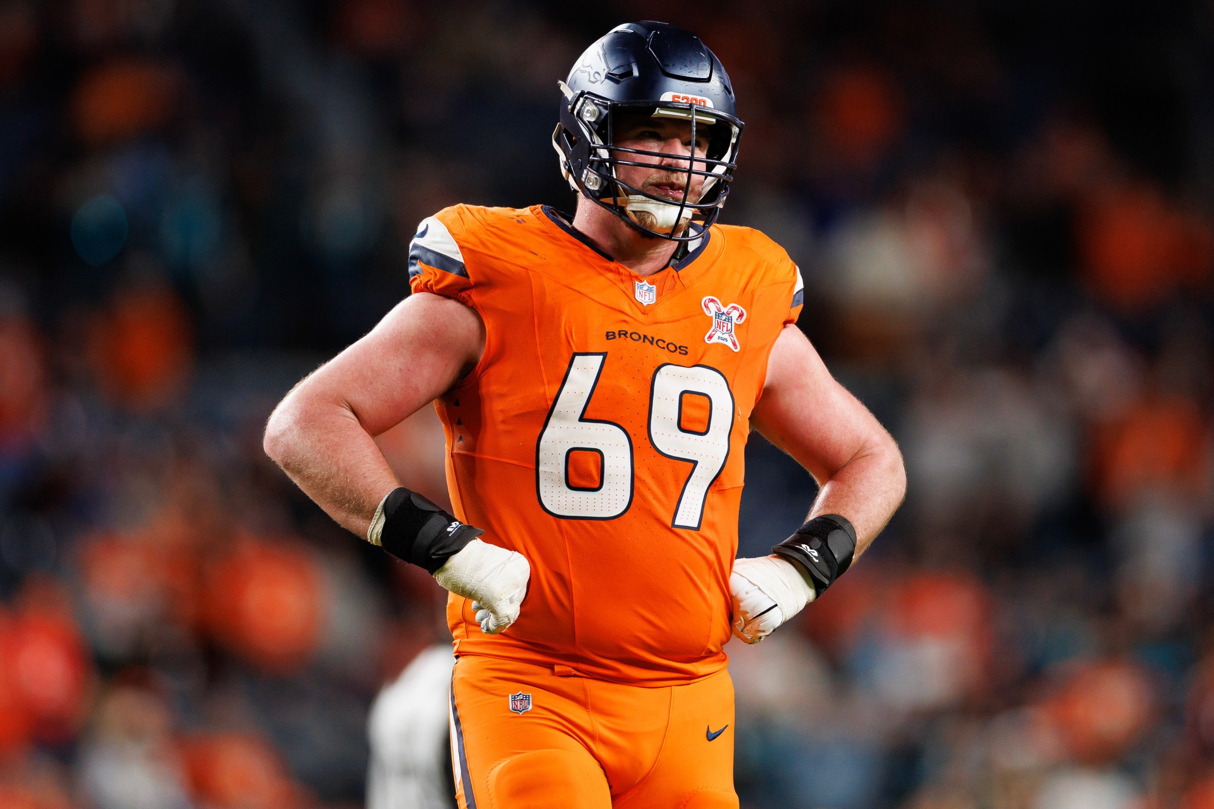 DENVER, COLORADO - DECEMBER 21: Mike McGlinchey #69 of the Denver Broncos stands on the field during the fourth quarter of an NFL football game against the Jacksonville Jaguars at Empower Field At Mile High on December 21, 2025 in Denver, Colorado. (Photo by Brooke Sutton/Getty Images)
