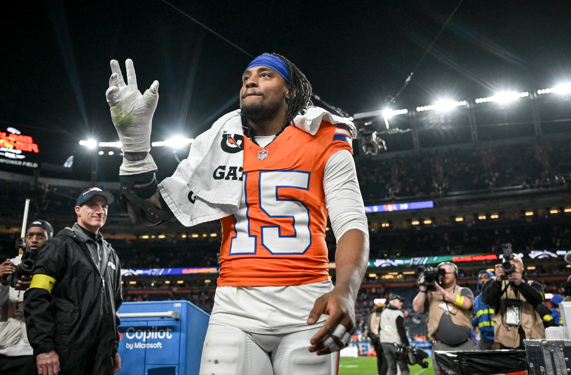 DENVER , CO - JANUARY 4: Nik Bonitto (15) of the Denver Broncos waves to fans after the Broncos’ 19-3 win over the Los Angeles Chargers at Empower Field at Mile High in Denver, Colorado on Sunday, January 4, 2026. (Photo by AAron Ontiveroz/The Denver Post)
