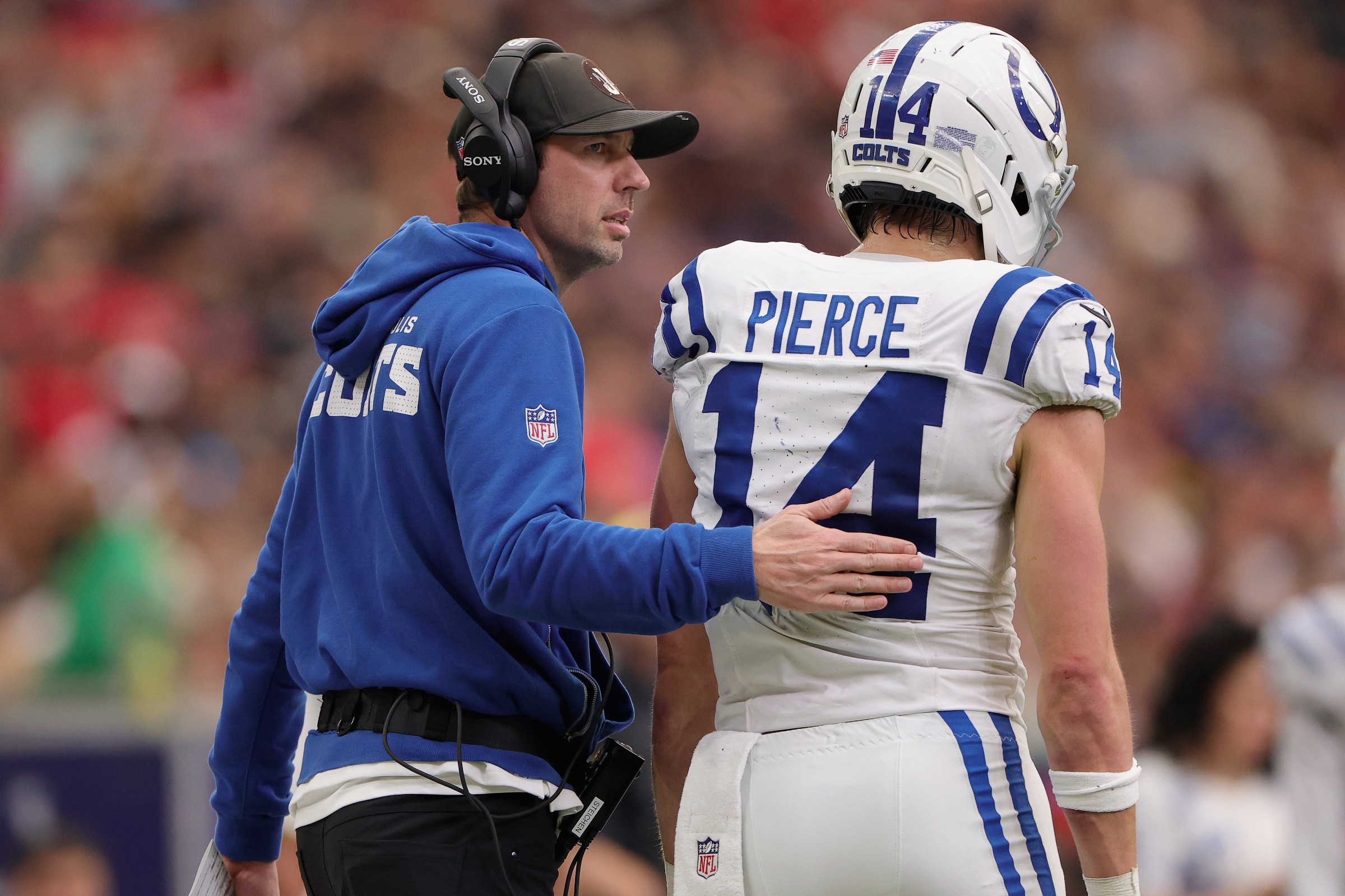 HOUSTON, TEXAS - JANUARY 04: Head coach Shane Steichen of the Indianapolis Colts walks with Alec Pierce #14 after Pierce was ejected from the game for making contact with a ref during the third quarter of the game against the Houston Texans at NRG Stadium on January 04, 2026 in Houston, Texas. (Photo by Alex Slitz/Getty Images)