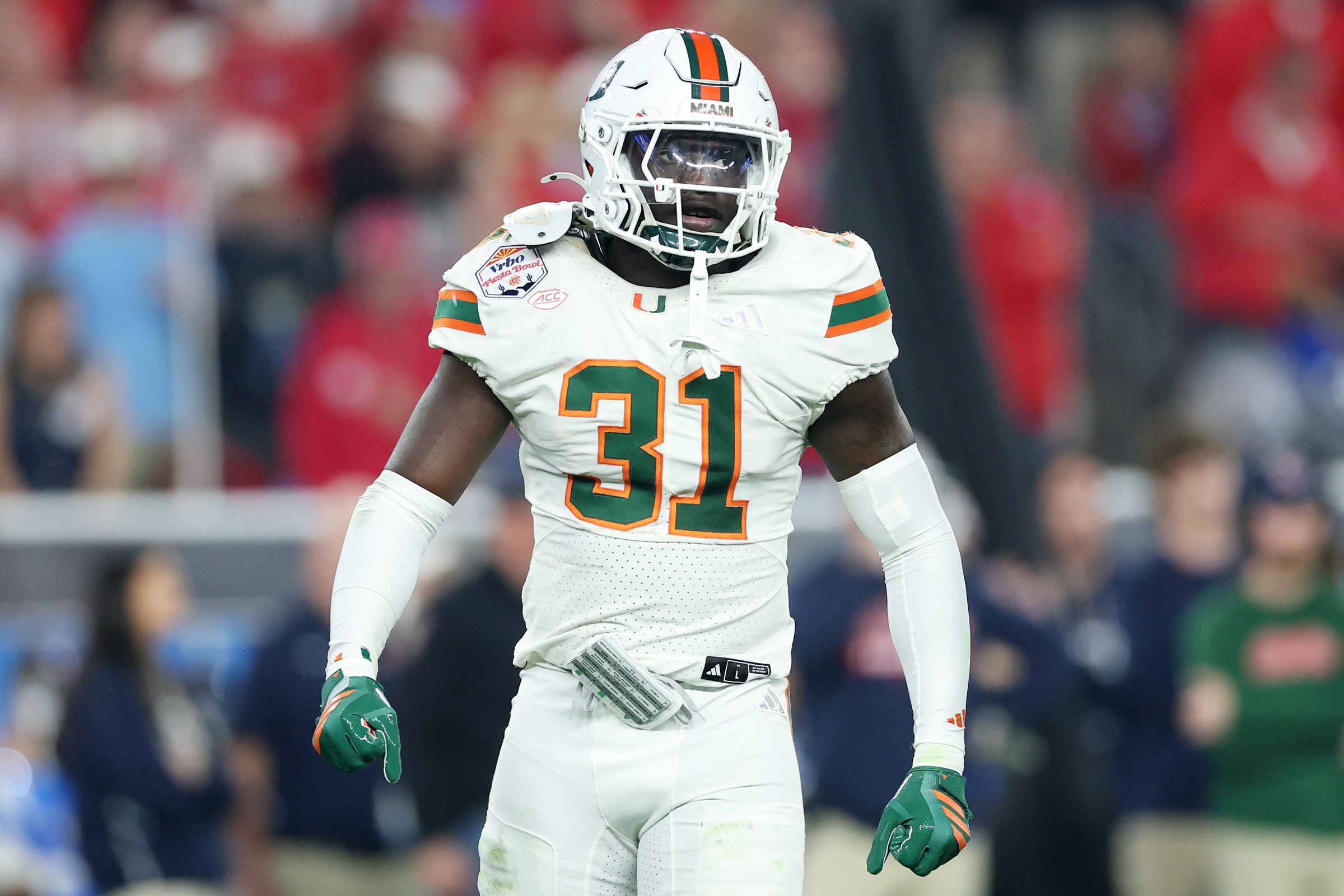 GLENDALE, ARIZONA - JANUARY 08: Wesley Bissainthe #31 of the Miami Hurricanes celebrates after a play against the Ole Miss Rebels in the first half during the 2025 College Football Playoff Semifinal at the VRBO Fiesta Bowl at State Farm Stadium on January 08, 2026 in Glendale, Arizona. (Photo by Christian Petersen/Getty Images)