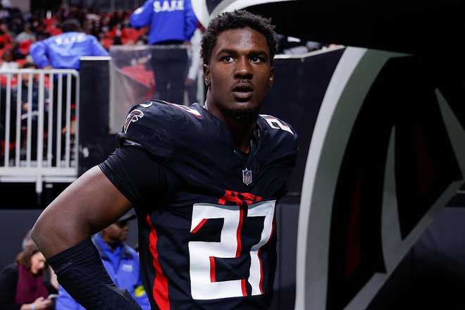 ATLANTA, GEORGIA - DECEMBER 7: James Pearce Jr. #27 of the Atlanta Falcons looks on prior to the game against the Seattle Seahawks at Mercedes-Benz Stadium on December 7, 2025 in Atlanta, United States. (Photo by Todd Kirkland/Getty Images)